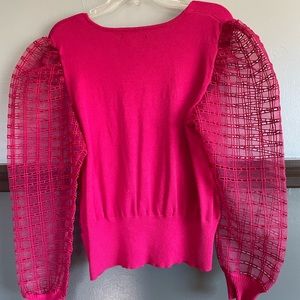 Pink Joseph A long sleeved mesh arm shirt.